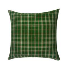 a green plaid pillow on a white background