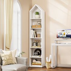 a living room filled with furniture and a white book shelf