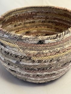 a close up of a woven basket on a table