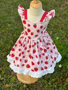 Sweet Summer Dress For Picnic, Cute Ruffled Sundress For Picnic, Cute Cherry Print Summer Dress, Pink Fruit Print Dress For Spring, Strawberry Print Dress For Garden Party In Summer, Summer Strawberry Print Dress For Garden Party, Summer Garden Party Dress With Strawberry Print, Cute Strawberry Print Dresses For Garden Party, Cute Cotton Dress For Garden Party