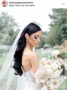 a woman in a wedding dress holding a bouquet