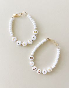 What's more fun then matching with your sister. This is sold as a set at a discount price. This is perfect for a baby announcement, baby shower, gift for sister, Christmas, birthdays. The options are endless!  Made with 7mm white and gold letter beads, and 14k gold filled metals.  Please measure wrist for most accurate fit.  Free shipping on the USA!  Message me for any questions!  Our bracelets are made proudly in the USA with product in the USA Big Bead Bracelets, Kid Bracelets, White Stone Bracelet, Toddler Bracelet, Sister Bracelet, Spring Bracelet, Trending Bracelets, Sister Jewelry, Daisy Bracelet