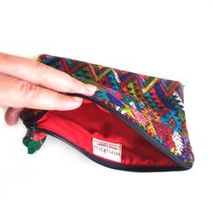 Looking for the perfect ZERO WASTE accessory? Then this little Pouch (and it's slightly smaller, sister Lunita) is what you've been looking for. This darling clutch sized Travel pouch is perfect for keeping your things in order when you travel near and far. Its bold textile print comes from re-purposed traditional hand-woven huipiles, the indigenous clothes of local Maya women. Instead of throwing out these leftover scraps from past projects, we preserve their integrity and give them a second li Multicolor Handheld Travel Pouch, Portable Multicolor Travel Pouch, Multicolor Pouch With Cell Phone Pocket For Daily Use, Multicolor Mobile Phone Pouch For Travel, Multicolor Travel Pouch, Multicolor Mobile Phone Travel Pouch, Multicolor Everyday Use Pouch, Portable Multicolor Pouch For Everyday Use, Multicolor Pouch Wallet For Daily Use