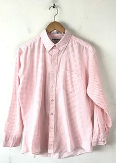 "-Description- >Mcgregor men's pink & white striped dress shirt >collared >button down >open pocket on the front >size 16 32/33 >so preppy! >condition: ok - a good amount of piling around the neck and under arms but still wearable >color(s): pink, white >fabric(s): 65 polyester / 35 cotton >brand: mcgregor >care: machine wash -Measurements- >size: 16 32/33 ✩ all measurements are taken with the item laying flat & some sizes are estimates so please check Summer Pink Cotton Dress Shirt, Pink Casual Collared Dress Shirt, Pink Collared Casual Dress Shirt, Casual Pink Collared Dress Shirt, Casual Pink Cotton Dress Shirt, Casual Pink Dress Shirt For Spring, Classic Pink Cotton Shirt, Classic Pink Cotton Dress Shirt, Pink Cotton Dress Shirt With Spread Collar