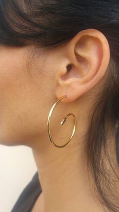 Snake hoop earrings in gold, shaped like a spiral, swirling and alluring. A unique design for the minimalist boho lover.Will fit any look- from fancy night out, to a summer music festival.- Material: gold plated brass (nickel free plating) or solid sterling silver- Size: 1.7 inch in diameter (4cm)- Packed in a lovely gift box ready to give as a gift- Ships within 3 business daysAdditional earrings of my design:https://www.etsy.com/il-en/shop/ZOZidesign?section_id=6545144Back to shop:https://www. Serpent Earrings, Gold Snake Earrings, Summer Music Festival, Earrings Snake, Serpent Jewelry, Arm Bracelets Upper, Edgy Earrings, Arm Bracelets, Ear Jacket Earring