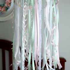 a baby crib with some ribbons hanging from it's side and the words simple diy that would