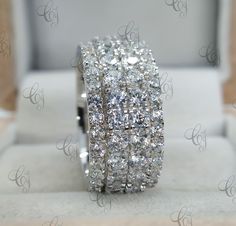 a diamond ring sitting on top of a white box