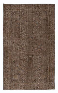 a brown rug with an intricate design on the top and bottom, it is made out of