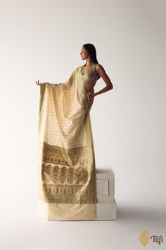 "\n One of our wondrous archival designs this season! Indulge in this heirloom Banarasi Baluchari treasure, alluding\u00a0to a bygone era. Adorned with the most delicate, many-hued meenakari and classical motifs on a smooth silken bed, this saree is a timeless\u00a0rendition\u00a0of heritage Banarasi artistry.\n\n\u00a0\n\n\nColor\u00a0- An elegant and timeless\u00a0shade of Off-White\u00a0\n\nTechnique\u00a0-\u00a0An enduring Kadwa weave\u00a0and masterly Meenakari.\u00a0The elaborate and laborious Kadwa technique involves hand-weaving each motif separately. It takes longer on the handloom, but makes a more robust pattern that stands out on the fabric.\u00a0Meenakari involves the painstaking addition of supplementary colored resham threads during the\u00a0hand-weaving\u00a0process.\n\n\nF Baluchari Saree, India Inspired, Katan Silk, Bygone Era, Weaving Process, Handloom Saree, Blouse Piece, Instagram A, Muse