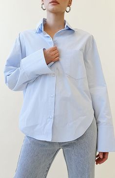 COLOR: POWDER BLUE DETAILS Features a oversized fit, button down front closure, collared neckline, rounded high-low hem, sleeve cuffs with button closure and front pocket design non-stretch 100% Cotton Please refer to the care label for garment care instructions SIZE & FIT: runs TTS, model wears size S/M MODEL INFO: HEIGHT 5’6, WAIST 25in, BUST 32in Classic Washed Blue Button-up Top, Washed Blue Button-up Top For Streetwear, Blue Button-up Shirt With Placket, Blue Button-up Top With Patch Pockets, Oversized Light Blue Button-up Top, Care Label, Ex Boyfriend, High Low Hem, Powder Blue