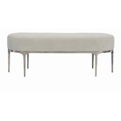 an oval bench with metal legs and a gray upholstered cushion on the top