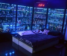 a bed in a room filled with shelves full of toy figurines and toys