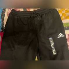 Black Adidas Sweatpants. Never Worn. Adidas Black Pants With Pockets, Adidas Sporty Black Bottoms, Sporty Black Adidas Bottoms, Adidas Black Sports Joggers, Adidas Black Sweatpants For Sports, Black Adidas Stretch Sweatpants, Adidas Black Sportswear Bottoms, Black Stretch Adidas Sweatpants, Adidas Black Bottoms With Elastic Waistband