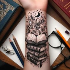 a person with a tattoo on their arm holding a stack of books and an open book