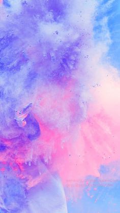 a man covered in colored powder on top of a blue sky