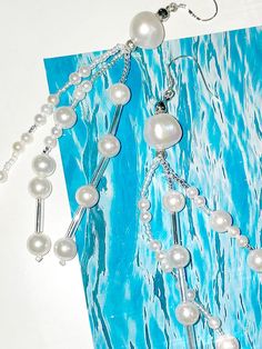 Composition : Freshwater pearls, seed beads, 925 silver needlesCountry of Origin : Republic of Korea Handmade Pearl White Pearl Earrings, Pearl White Sterling Silver Pearl Earrings With Chain, Beaded Pearl Dangle Jewelry, Pearl Beaded Dangle Jewelry, White Beaded Pearl Earrings, White Dangle Pearl Chain Earrings, Sterling Silver White Pearl Earrings With Pearl Chain, Sterling Silver White Pearl Chain Earrings, White Pearl Jewelry With Silver Beads