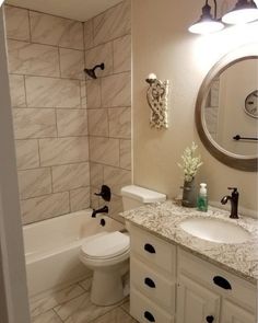 a bathroom with a sink, toilet and bathtub