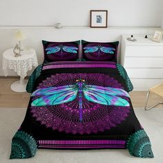 a bed with purple and blue dragonflies on it