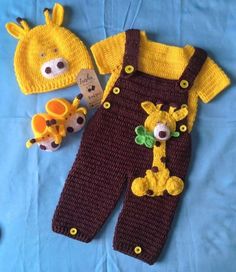 a knitted baby's outfit, hat and stuffed animal