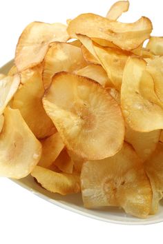 a white plate topped with sliced up potato chips