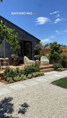 the back yard is clean and ready to be used as an outdoor space for entertaining