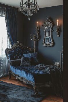 a bed sitting in the middle of a bedroom next to a chandelier and window