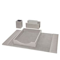 a set of gray bathroom accessories on a white background