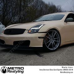 a beige car parked in a parking lot