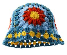 a crocheted blue hat with orange and yellow flowers on the front, sitting against a white background