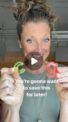 a woman is holding up some candy in front of her face with the caption you're going want to save this for later