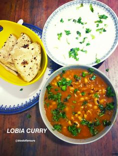 three bowls of food on a table with tortilla and salsa in the background