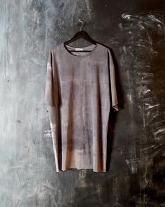 "Naturally dyed cotton top. Loose fit dystopian long t-shirt. Raw edge sleeve, neck and bottom. Fabric is hand dyed using organic plant matter. Each piece is dyed individually and no two can ever be the same. Loose fit M size Measurements: Chest: 50\" (128 cm) Bottom: 50\" (128 cm) Shoulders: 25\" (65 cm) Sleeve: 11\" (27 cm)  Length: 36\" (90 cm)  One of the kind top! #194" Acid Wash Cotton T-shirt With Natural Dye, Faded Relaxed Fit Pre-washed Tops, Relaxed Fit Acid Wash Tops, Acid Wash Tops With Relaxed Fit, Acid Wash Pre-washed Relaxed Fit Tops, Relaxed Fit Pre-washed Washed Black Tops, Relaxed Fit Tie-dye Tops With Natural Dye, Relaxed Fit Tie Dye Tops With Natural Dye, Hand-dyed Washed Black Cotton Tops