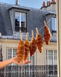 bacon hanging from clothes line in front of building