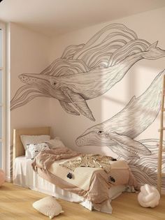 a room with a bed, window and wall mural on the walls that has dolphins painted on it