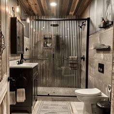 An industrial bathroom with a corrugated metal shower surround, paired with matte black fixtures and hardware3