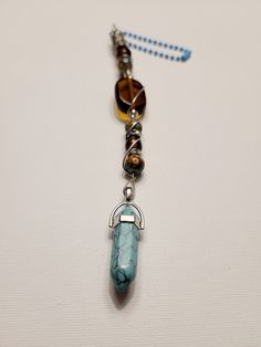 Each item is handmade with beautiful colored glass beads, rhinestones and a crystal pendant. Hang with ball chain Handcrafted in smoke/pet free home.  Makes a unique gift for a loved one or treat yourself. You deserve it! Measurements are from bottom of pendant to top of ball chain  Purple pendant: 8 inches  Teal pendant: 8 inches Green pendant: 7.5 inches Beaded Crystal Necklaces As Gift, Beaded Mineral Crystal Necklaces As Gift, Beaded Mineral Crystal Necklace As Gift, Handmade Round Beads Crystals For Gifts, Spiritual Beaded Crystals For Gift, Gift Beaded Necklaces With Mineral Crystal Stones, Handmade Spiritual Czech Glass Crystal Necklace, Bohemian Multicolor Crystals For Gift, Handmade Czech Glass Crystal Necklace Gift