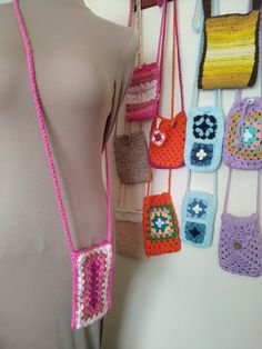 Small crossbody or shoulder bag handmade in crochet. Perfect for mobile, wallet and keys. In fuchsia pink on 1 side and shades of pink on the other in a rectangular Granny Square design. With button closure. Measurements: width 10 cm, height 17 cm, handle length in the center 62 cm. It can be done in other colors or sizes. Check by message please. Orders are made in 10 - 14 days Small cross body or shoulder bag handmade in crochet. Perfect for mobile phone, purse and keys. In plain fuschia pink Pink Square Phone Bag For Daily Use, Pink Square Phone Bag For Everyday Use, Pink Crochet Crossbody Bag For Everyday, Pink Crossbody Crochet Bag For Everyday Use, Pink Granny Square Bag For Everyday Use, Everyday Pink Bags With Granny Square Detail, Pink Square Crochet Bag For Everyday Use, Pink Crochet Crossbody Bag For Daily Use, Summer Pink Crochet Crossbody Bag