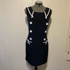 Nwt Rare Super Cute Oxiuli Fashion Navy Blue Dress. Sleeveless Full Lining. Back Zipper, Two Small Pockets In The Front Decorated With White Ribbon. Extra Large White Bottoms Details. Sailor Style. It Does Not Have Any Tag For Quality Of Material But It Feels Like Lightweight Polyester. Size Large. Does Not Stretch. Please Double Check All The Photos For Measurements And Details It Might Be Smaller Than A Size Large. Reasonable Offers Welcome. Sleeveless Party Dress With Buttons, Casual Navy Sleeveless Mini Dress, Blue Retro Sleeveless Mini Dress, Retro Blue Sleeveless Mini Dress, Blue Sleeveless Retro Mini Dress, Retro Sleeveless Dress With Buttons, Navy Sleeveless Fitted Dress, Navy Fitted Sleeveless Dress, Blue Sleeveless Dresses With Buttons