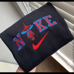 *Due To Increased Demand And The Handmade Nature Of The Item Please Allow Up To 2 Weeks For Your Order To Be Shipped!* Made To Order “Nike Spiderman” Will Be Embroidered On A Black Gildan Heavyblend, Jerzee Or Hanes Crewneck Sweatshirt Resembling The Image Above. View More Of My Work On Instagram @Resol.Co And Feel Free To Message With Any Custom Orders. Sizes S-Xl Currently Available! Embroidery Is Done With A 5x7in Standard Embroidery Hoop. The Photo In This Listing Is An Exact One I Made Myse Black Crew Neck Top With Embroidered Logo, Black Top With Letter Embroidery For Streetwear, Black Letter Embroidery T-shirt For Streetwear, Black Crew Neck Top With Letter Embroidery, Nike Spiderman, Spiderman Sweatshirt, Nike Crewneck Sweatshirt, Anime Streetwear, Navy Blue Sweatshirt