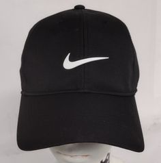 This Nike Dri-Fit Club Cap is the perfect accessory for any occasion. The hat features an adjustable strap and the iconic Nike Swoosh logo. It is made from high-quality polyester material, ensuring a comfortable fit and durability. The hat is suitable for both men and women and comes in the classic black and white color scheme. Whether you're playing sports, traveling, or just running errands, this Nike hat is a must-have. Its solid pattern and structured design make it a versatile piece that can be worn in any season. Upgrade your wardrobe with this stylish and functional hat today! New and Unused Condition (see photos for measurements) Any questions please ask Fast Shipping!!!!! Nike Hat, Nike Swoosh Logo, Fitness Club, Black Cap, Black And White Colour, Nike Dri Fit, Dri Fit, Classic Black, Accessories Hats