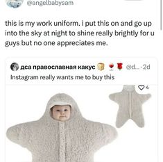 the baby is wearing a hooded jacket and holding an instagramtion star on twitter