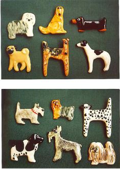 there are many different dog magnets on the table