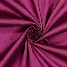 a close up shot of the fabric in magentac pink, which is very soft