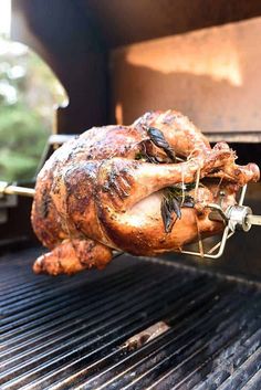 a chicken is being cooked on the grill