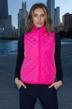 Due to popular demand, the Golftini Wind Vest now comes in a rich, vibrant hot pink! The high-end quilted fabric is soft and lightweight, yet durable. Wear this solid vest with your favorite Golftini skort to complete your look. Fitted Quilted Nylon Vest, Fitted Pink Vest Outerwear, Pink Fitted Vest For Winter, Pink Fitted Sleeveless Outerwear, Pink Fitted Nylon Outerwear, Fitted Pink Nylon Outerwear, Golf Vest, Quilted Fabric, Quilted Vest