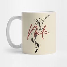 a white coffee mug with the word nude on it