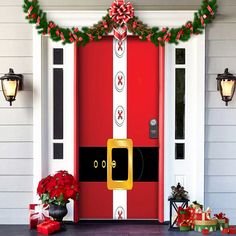 a red door decorated with christmas decorations and presents