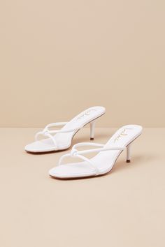 The Lulus Victoire White Knotted Strappy High Heel Slide Sandals are here to complete all your simply stunning date night looks! These strut-worthy sandals have a faux leather construction that shapes an open-toe upper and an almond-shaped footbed. Crisscrossing straps boast a knotted detail atop the slide-on silhouette that sits atop a flirty stiletto heel. 2. 75" wrapped stiletto heel. Cushioned insole. Rubber sole has nonskid markings. Man made materials. Imported. Lulus | Victoire White Knot Elegant Toe Post Sandals For Night Out, Elegant Summer Sandals For Date Night, Spring Date Night Sandals With Single Toe Strap, Leather Strappy Sandals For Date Night, Elegant Synthetic Toe Post Sandals, Elegant Toe Post Synthetic Sandals, Elegant Summer Toe Post Heels, Summer Sandals With Padded Heel For Date Night, Chic Strappy Sandals For Date Night