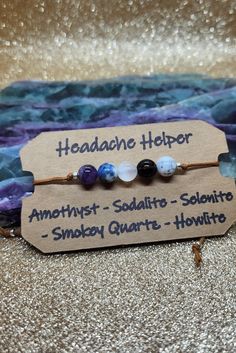 If you struggle with stress and tension causing headaches, the headache helper sliding knot adjustable bracelet may be for you (not meant to replace medical interventions)  Amethyst is a natural tranquilizer that eases and alleviates pain / also a stone of peace and serenity  Sodalite promotes calmness of the mind / clears away mental fog associated with headaches  Selenite cleanses energy / washes away stress and tension associated with headaches  Smokey Quartz  reduces stress and tension associated with headaches or that can trigger migraines  Howlite decreases stress and tension in the mind and body Chakra Balancing Essential Oils, Starting Etsy Shop, For Headaches, Witchy Crafts, Crystals Healing Properties, Crystal Healing Stones, Diy Wire Jewelry, Sliding Knot, Handmade Jewelry Gift