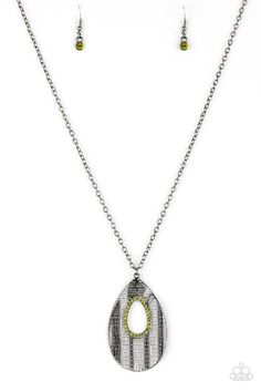 Embossed in a linear geometric pattern, a warped gunmetal teardrop swings from the bottom of a lengthened gunmetal chain. Glittery green rhinestones are encrusted around the center of the teardrop pendant for a sparkling finish. Features an adjustable clasp closure.

 Sold as one individual necklace. Includes one pair of matching earrings. Green Zebra, Classy Jewelry, Paparazzi Accessories, Teardrop Pendant, Teardrop Necklace, Paparazzi Jewelry, Green Necklace, Small Earrings, Necklace Earring Set